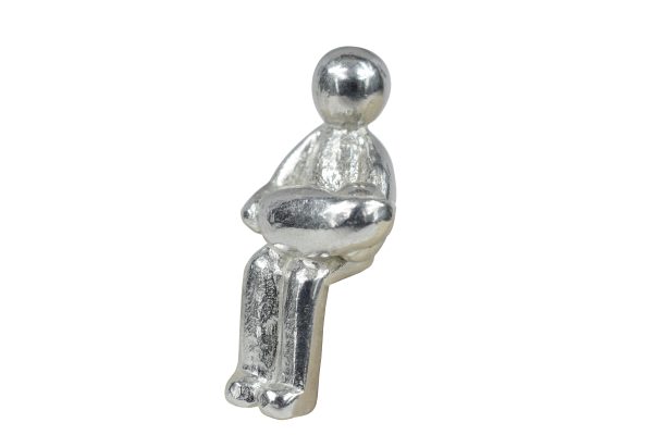 a metal figure holding a baby