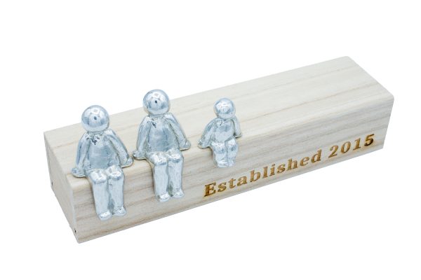 metal figures on a wooden box